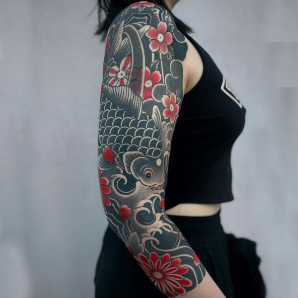 Beautiful cherry blossom and koi fish tattoo over the arm 