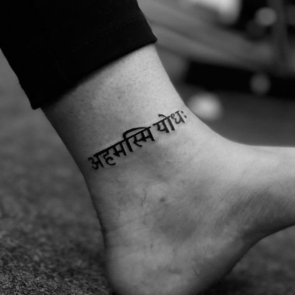 A Sanskrit script Ahamasmi Yodha" meaning 'I am a warrior' ankle tattoo design