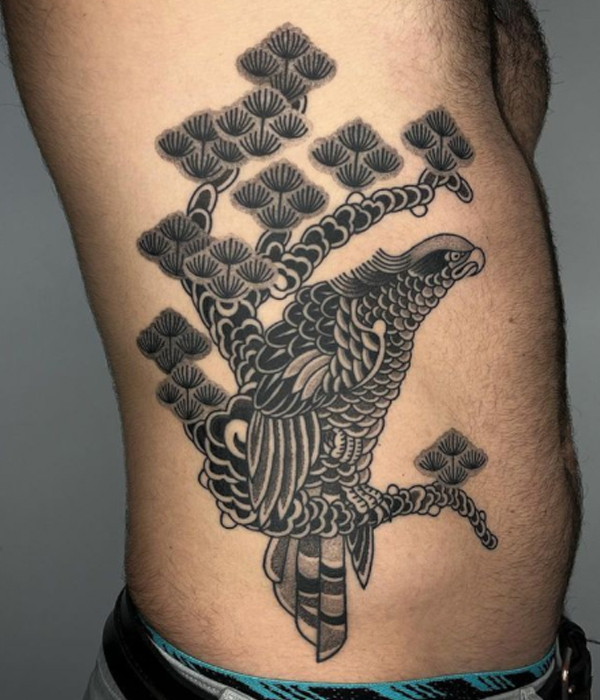 Awesome black fine detailing eagle and pine tree tattoo design