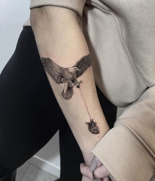 Small eagle with the heart tattoo design