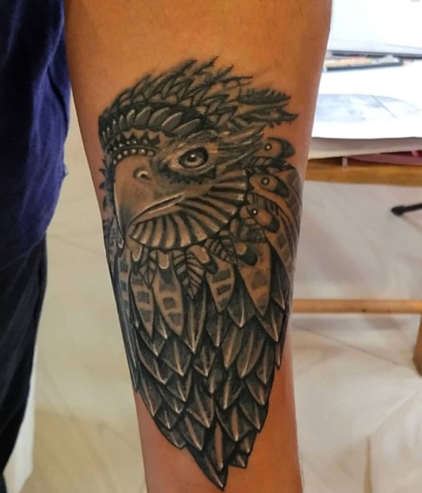 Stunning black and grey native American-style tattoo